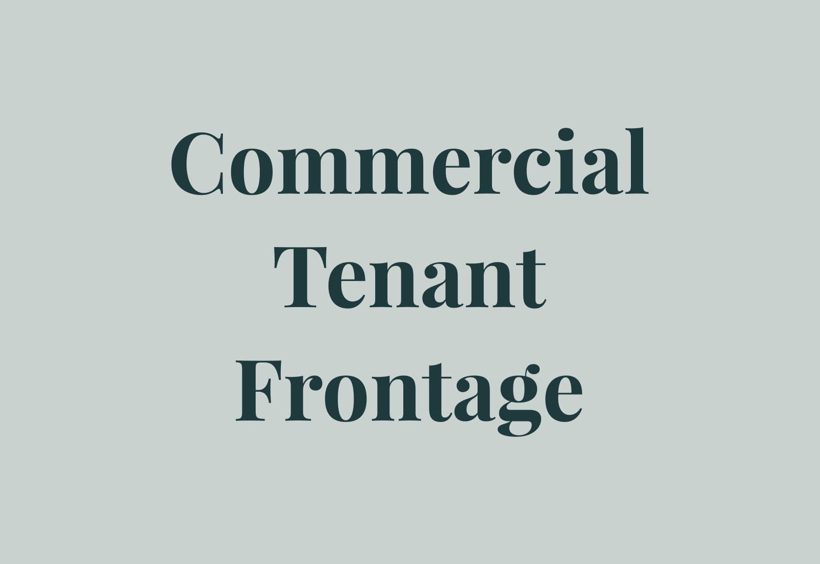 Commercial tenant frontage with signage band, glazing, and restrained material palette.